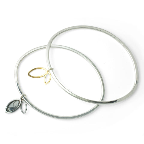 'Flourish' oval bangle with charm